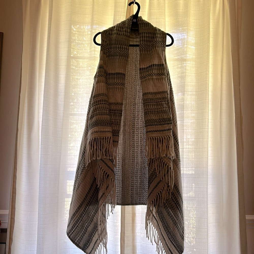 Women’s long sweater vest.